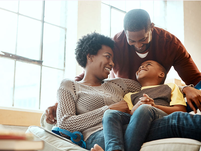 smiling mother, father and son